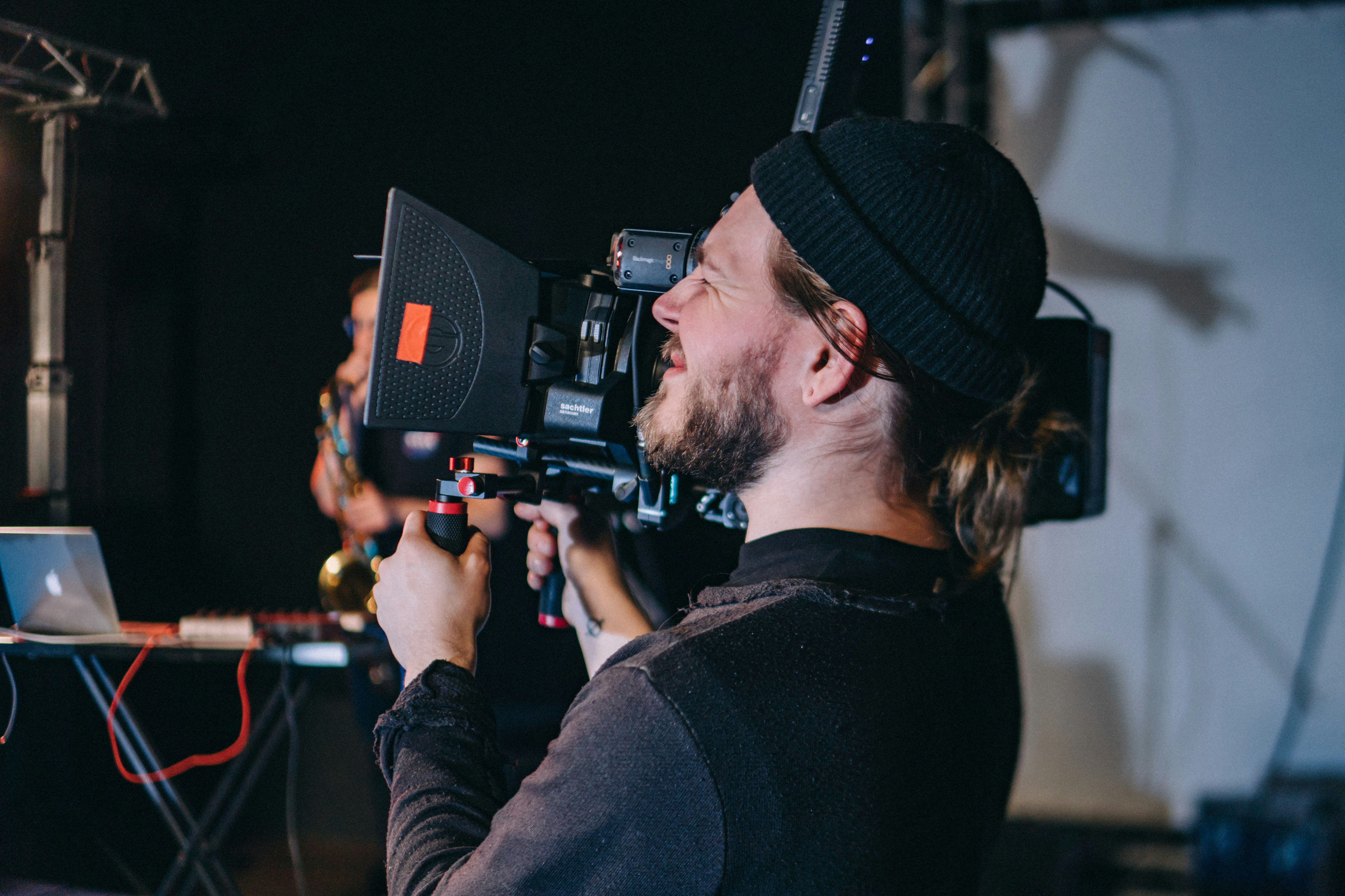 man holding video camera